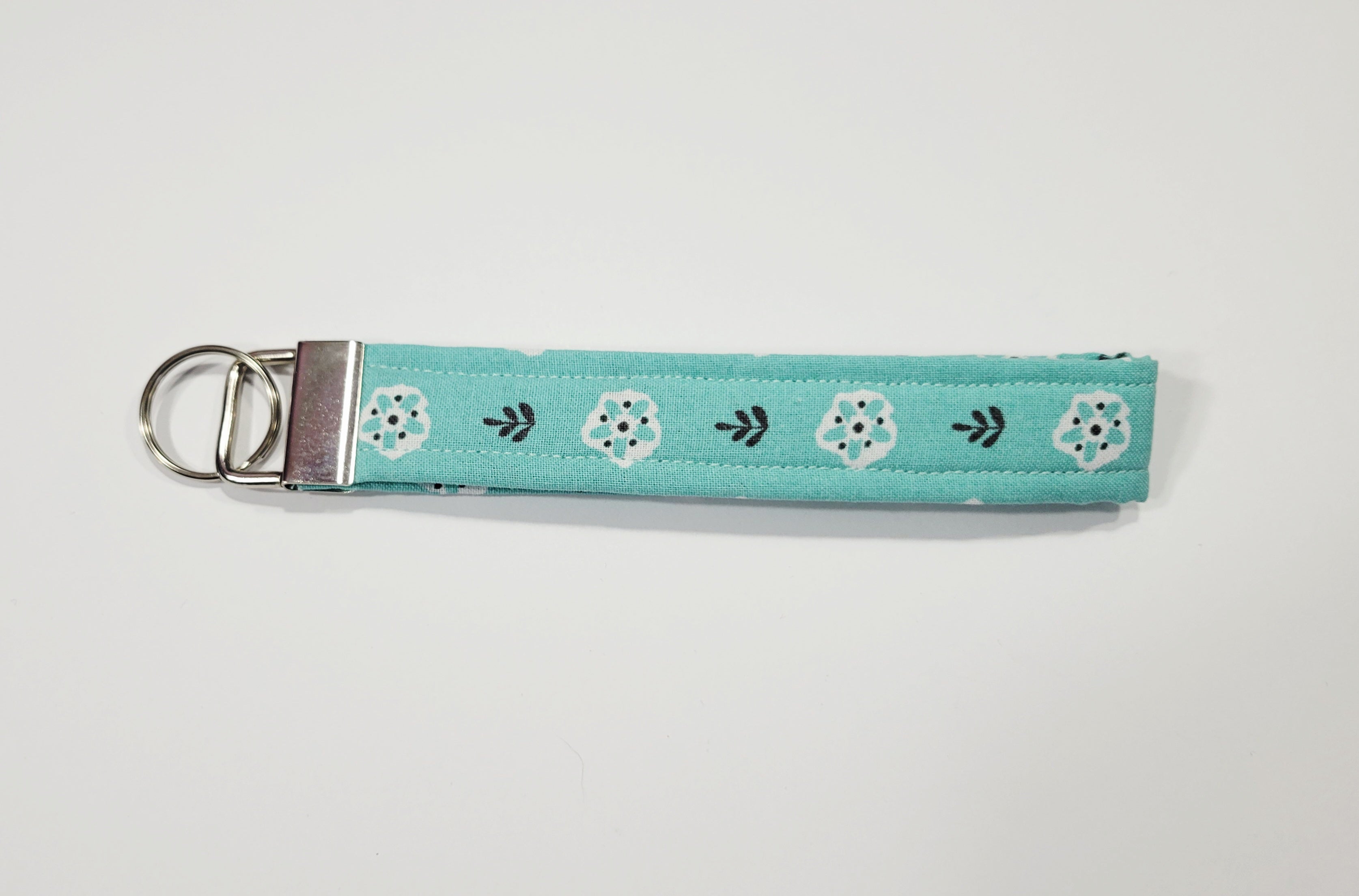 White Flower on Teal Wristlet Keychain