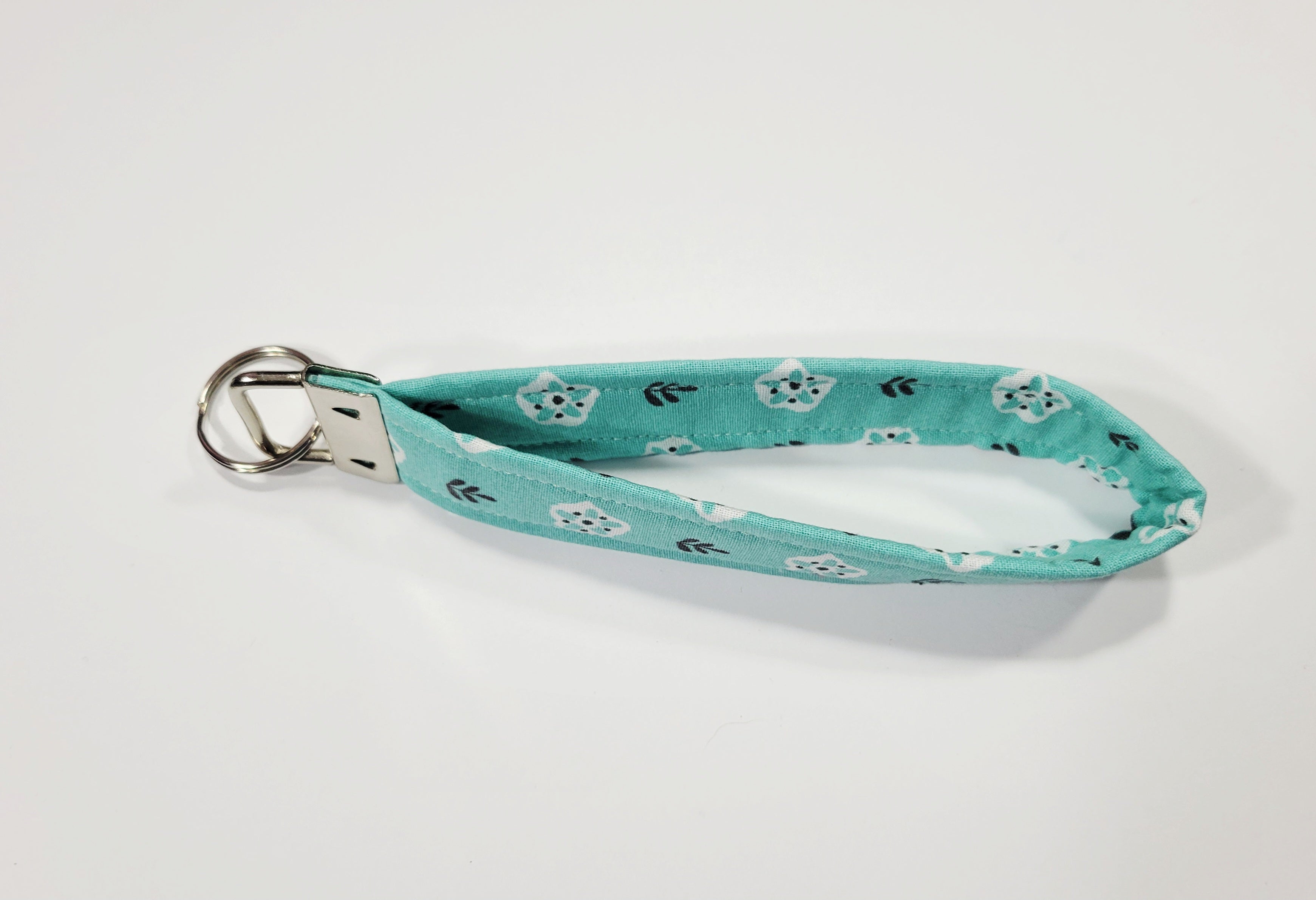 White Flower on Teal Wristlet Keychain